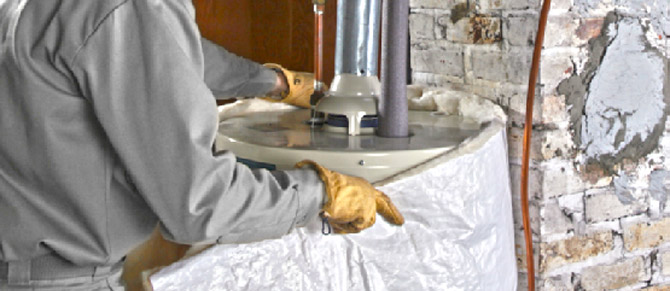 plumber installing water heater jacket