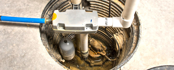 a sump pit in the basement of a Scarborough home with a sump pump installed in the bottom