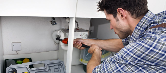 toronto home owner attempting diy drain cleaning procedure before ruining his kitchen