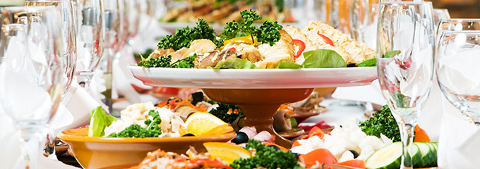 food on a table at a holiday party during a blocked drain plumbing emergency